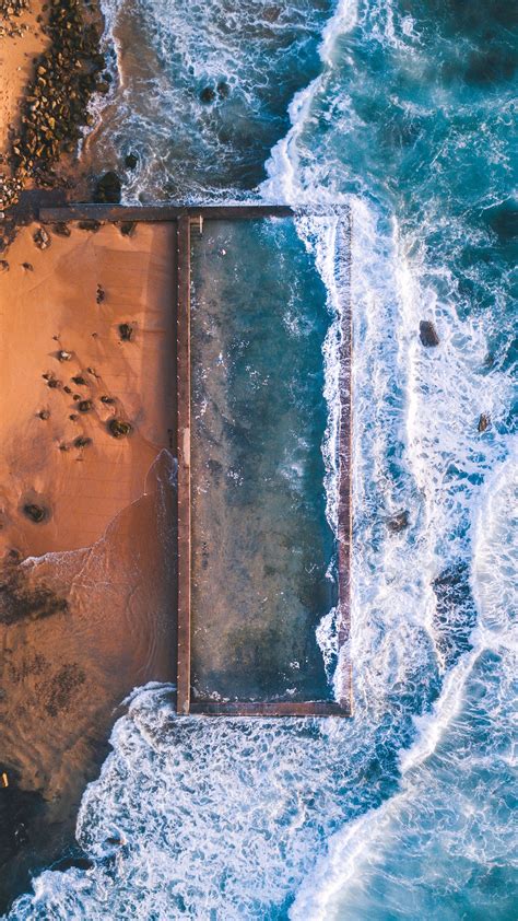 aerial view  beach rocks ocean iphone wallpaper iphone