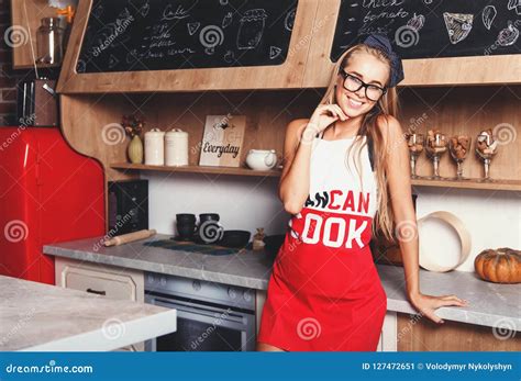 Blonde Attractive Housewife Smiling On The Kitchen Stock Image Image