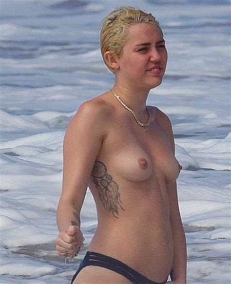 celebrity miley cyrus is topless at the beach