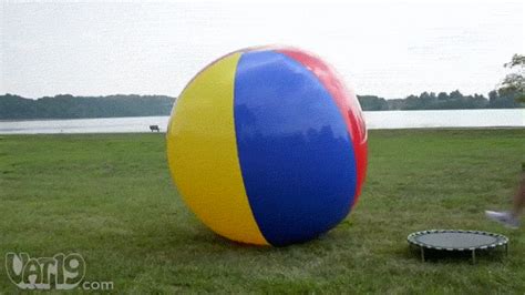 girl bouncing on beach ball s find and share on giphy