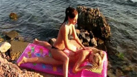 2 Girls On Beach Oiling Each Other On Mattress Inflas Balloons By