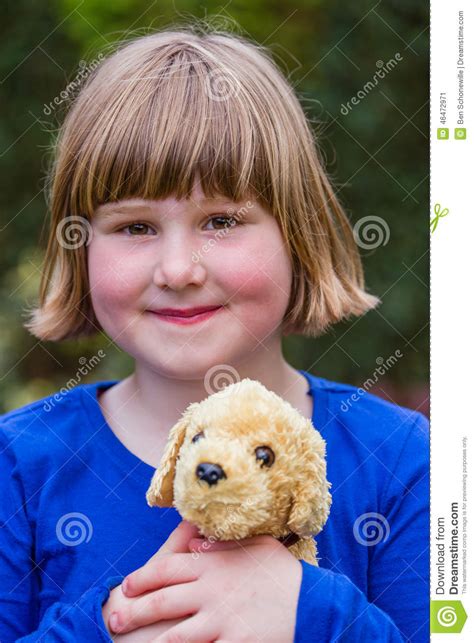 young girl holding stuffed dog stock image image  funny caucasian