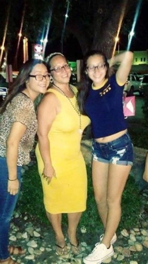 cute asian mom in yellow dress or her sexy daughters