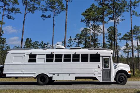 converted school bus camper   cozy tiny home  wheels curbed