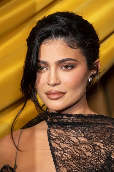 Kylie Jenner Wears Sheer Cutout Lace Dress Making Her Bare Skin Part Of