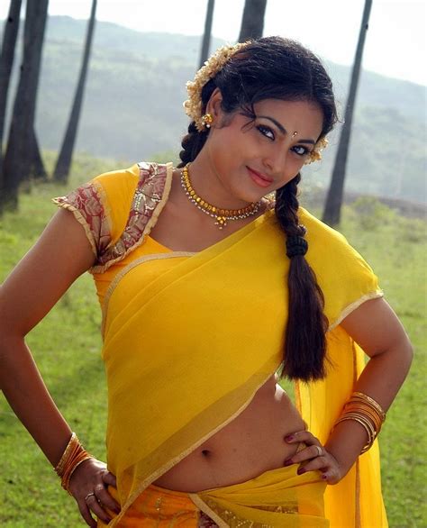 Meenakshi Sexy Navel Show In Yellow Half Saree Photos