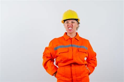 free photo firewoman in her uniform with a safety helmet
