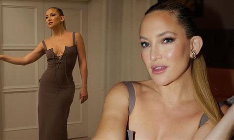 kate hudson shows off her enviable curves in a plunging grey gown while