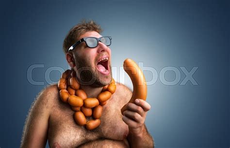 Hungry Man With Sausages Round His Neck Stock Image Colourbox
