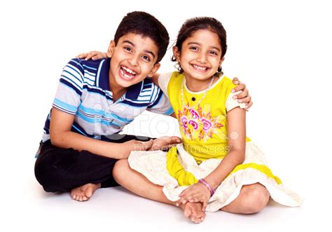 portrait of cheerful indian brother and sister isolated on white stock