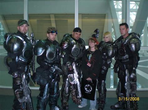 xbooru 2008 bandanna body armor cosplay gears of war gun lancer photo sunglasses weapon 143963