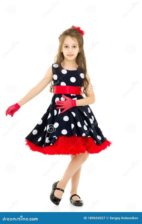 full length portrait of pretty girl in polka dot dress stock image