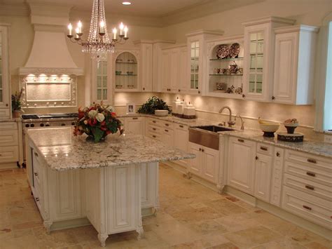 traditional kitchen design  white cabinets  marble countertop   island glass