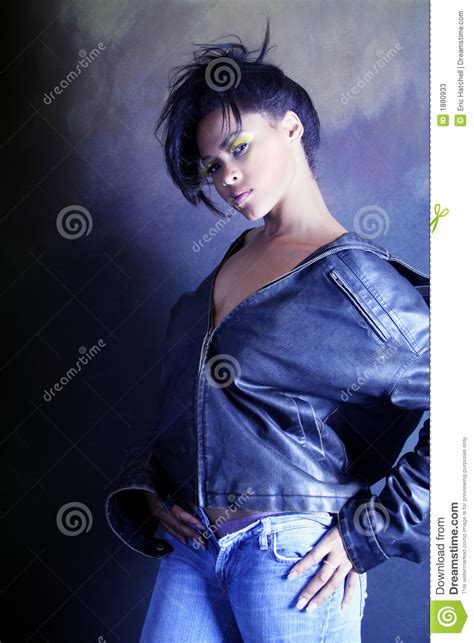teenage african american black girl wearing a leather jacket showing