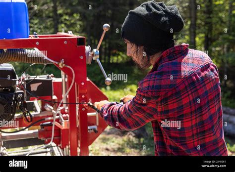 lumberjack     wearing black hat  red checked shirt