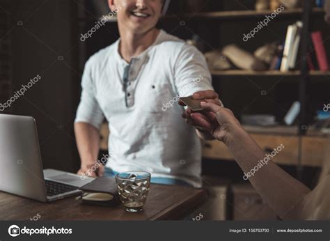 man paying  credit card stock photo  dimakozitsyn