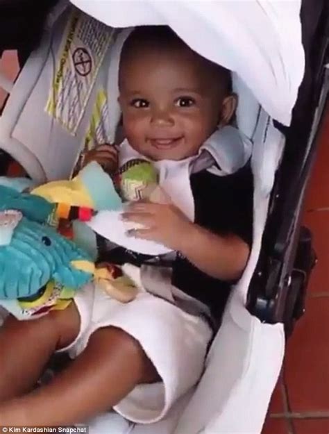 saint west giggles in his stroller while north gives her goofiest smirk as they join mom kim at