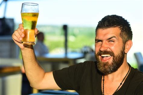 Handsome Barman Holding A Pint Of Beer Man Holds Glass Of Beer Enjoy