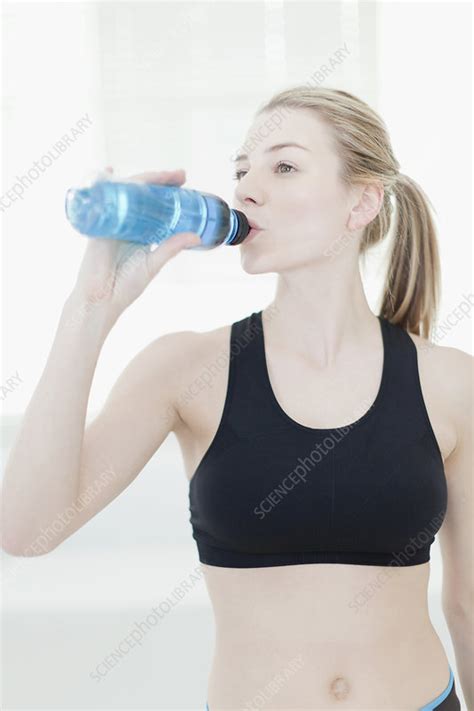 Woman Drinking Water During Workout Stock Image F004