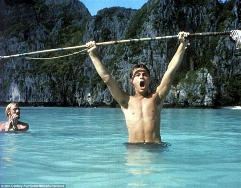 Dicaprio Wades In The Water Of Maya Bay During A Scene In The Movie The