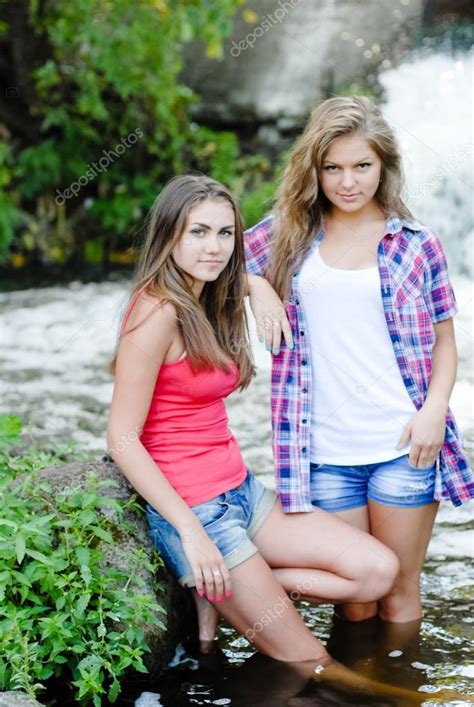Two Teen Girls And Summer Outdoors Near Waterfall — Stock