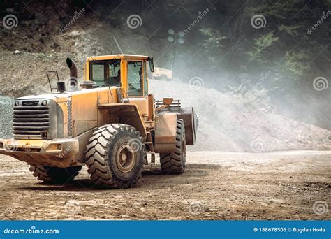 heavy duty industrial wheel loader loading rock  ore  crushing  sorting plant quarry