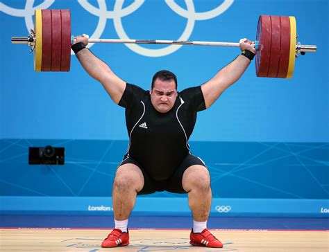 iranian weight lifter wins gold  mens super heavyweight division