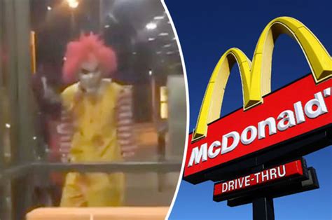 killer clown terrifying ronald mcdonald gives customers a big mac and