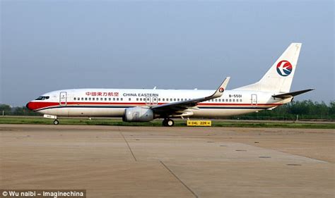 air hostess falls out of cabin door onto tarmac in china daily mail online