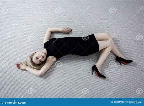 beautiful dead woman  black dress lying   floor stock image