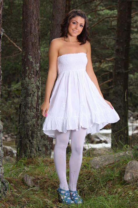 cute white dress and sexy white stockings on teen posing