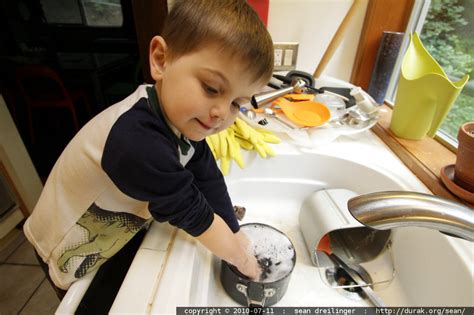 photo washing the dishes for his sick dad by seandreilinger