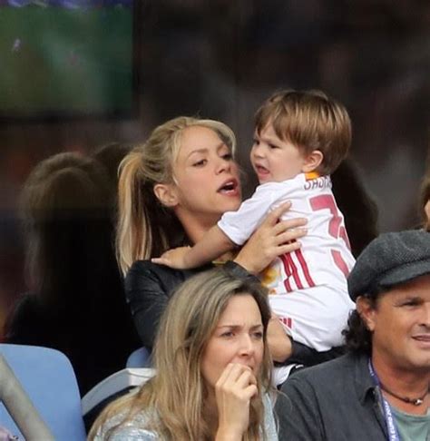 shakira and sons cheer on her partner football star gerard pique during his game