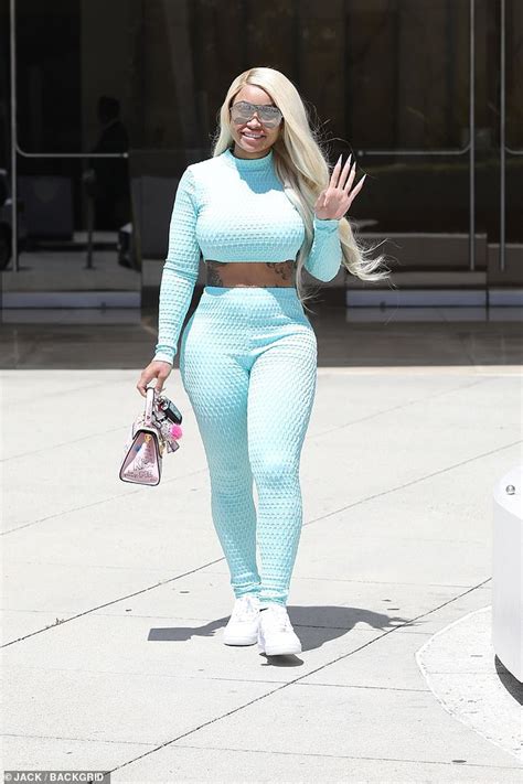 blac chyna shows off her signature curves in an aqua look after being accused of embezzlement