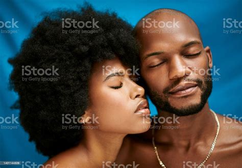 Closeup Of A Beautiful African Couple Standing With Their Eyes Closed