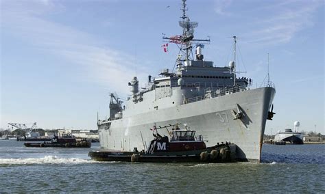 navy ship shoots  drone   laser beam