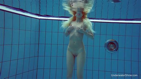 Blond Swimming Chick Tracy Gets Naked And Shows Tricks