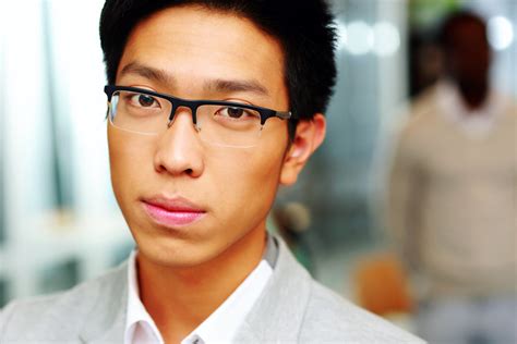 Closeup Portrait Of A Handsome Asian Man In Glasses Royalty Free Stock
