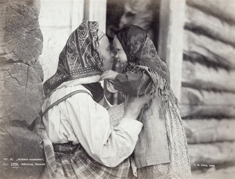 Aunt Rubs Noses With Her Niece In The Village Of Uhtua Karelia