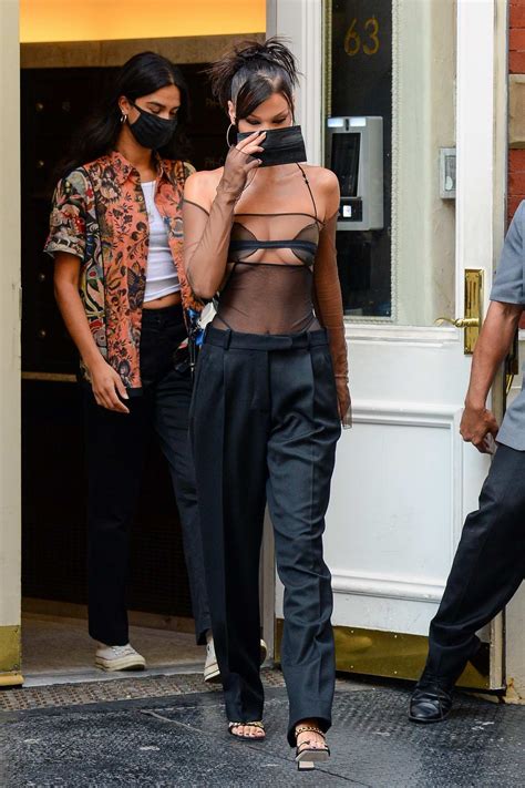 bella hadid looks stunning in a sheer black top with