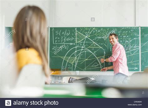 teacher writing  board  classroom stock photo alamy