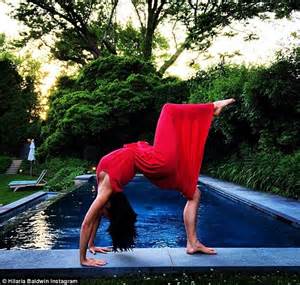hilaria baldwin reveals side boob as she performs another yoga pose