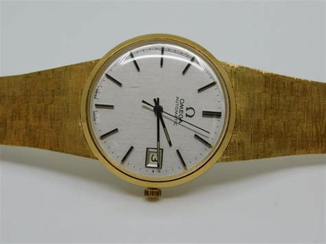 18 karat gold swiss omega automatic mans wrist watch for sale at 1stdibs
