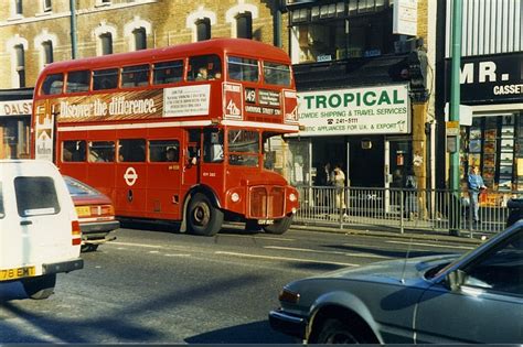 pictures of iconic routemaster buses on the streets of london in the 1980s ~ vintage everyday