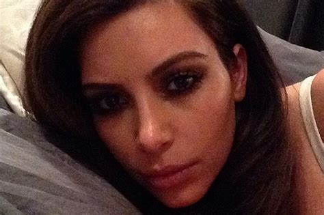 Kim Kardashian Shows In Bed Selfie With Brunette Locks As She Lies In