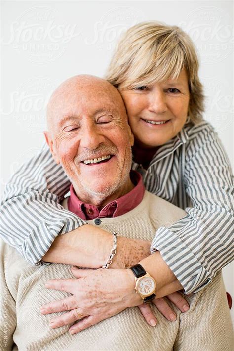 Elderly Couple In Love Smiling Together On White By Stocksy