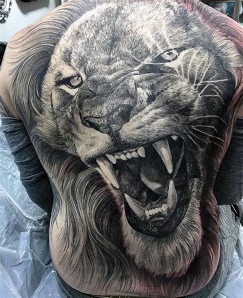 giant  realistic super detailed roaring lions head   tattoo