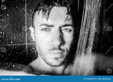Hunky Handsome Man Male With Beard And Muscular Arms Is Wet In Shower