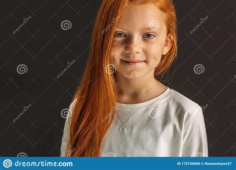 little red haired girl isolated on black stock image image of