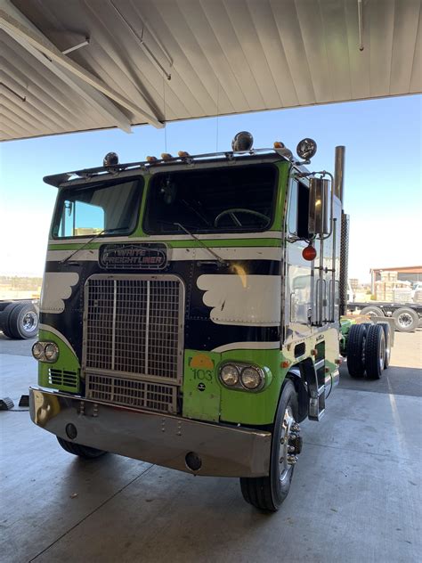 rolled    white freightliner cabover rtruckers
